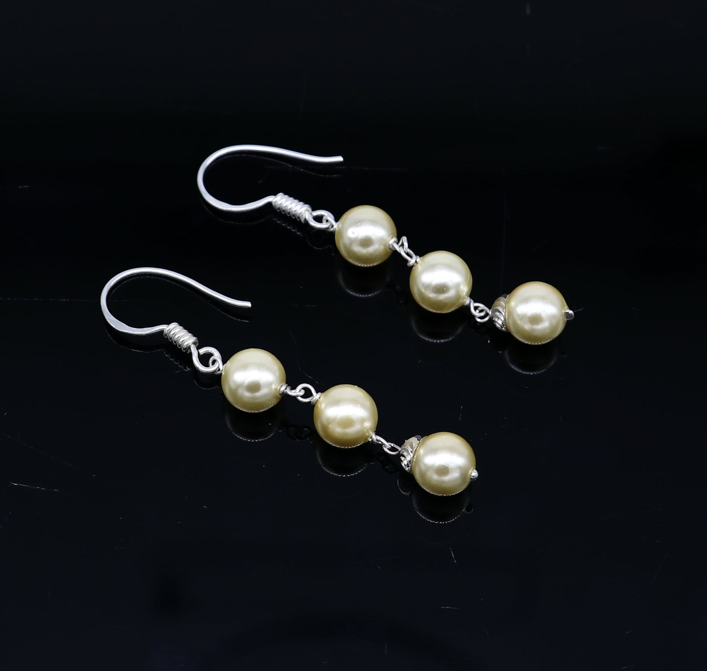 Sterling silver handmade hoop earrings with pearl drops, dangling design, suitable for bridesmaids, by TRIBAL ORNAMENTS.