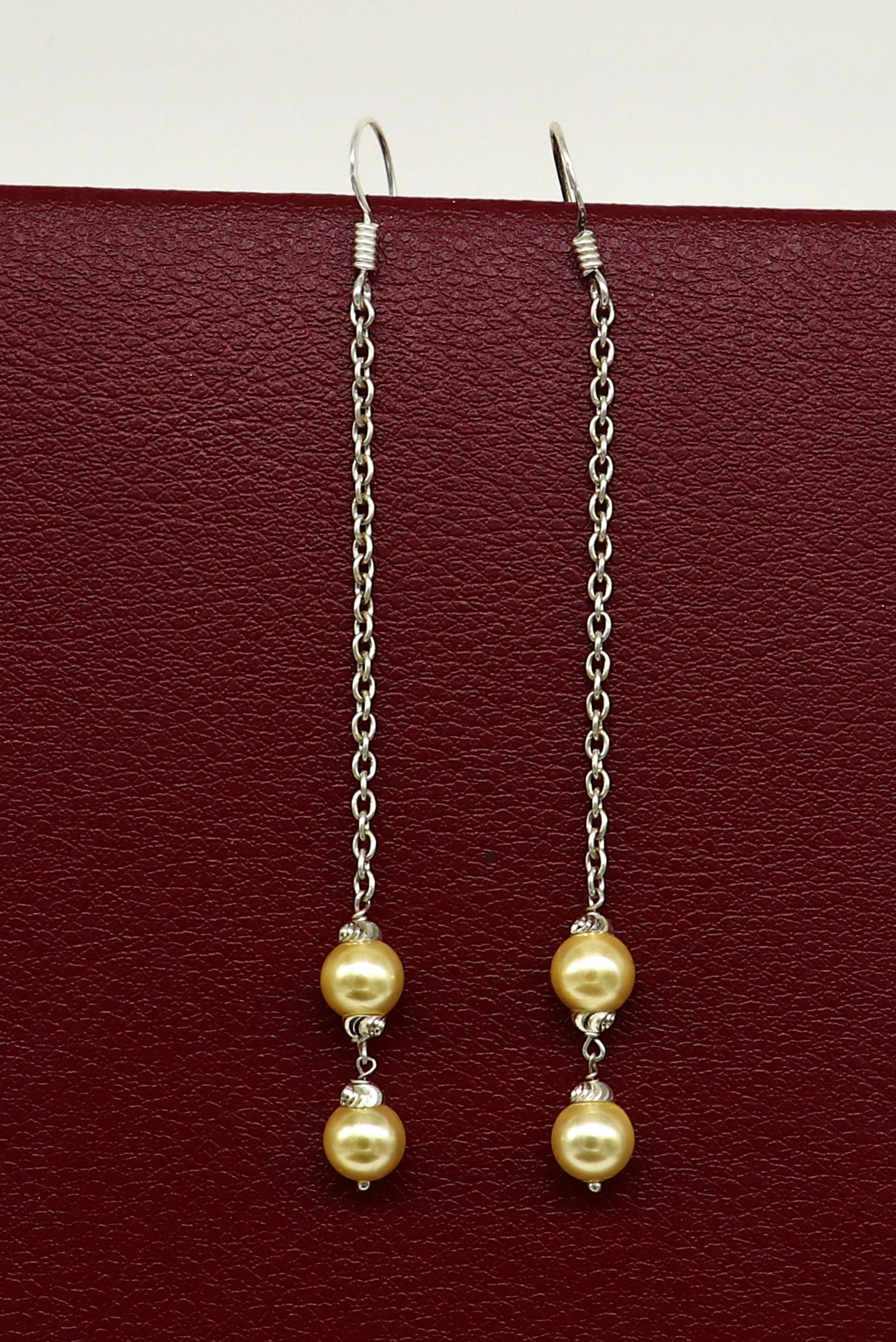 Sterling silver handmade hoop earrings with dangling pearls, perfect for bridesmaids or special occasions, from TRIBAL ORNAMENTS.