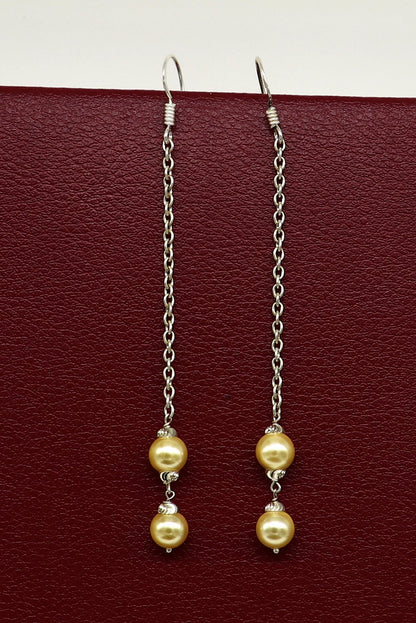 Sterling silver handmade hoop earrings with dangling pearls, perfect for bridesmaids or special occasions, from TRIBAL ORNAMENTS.