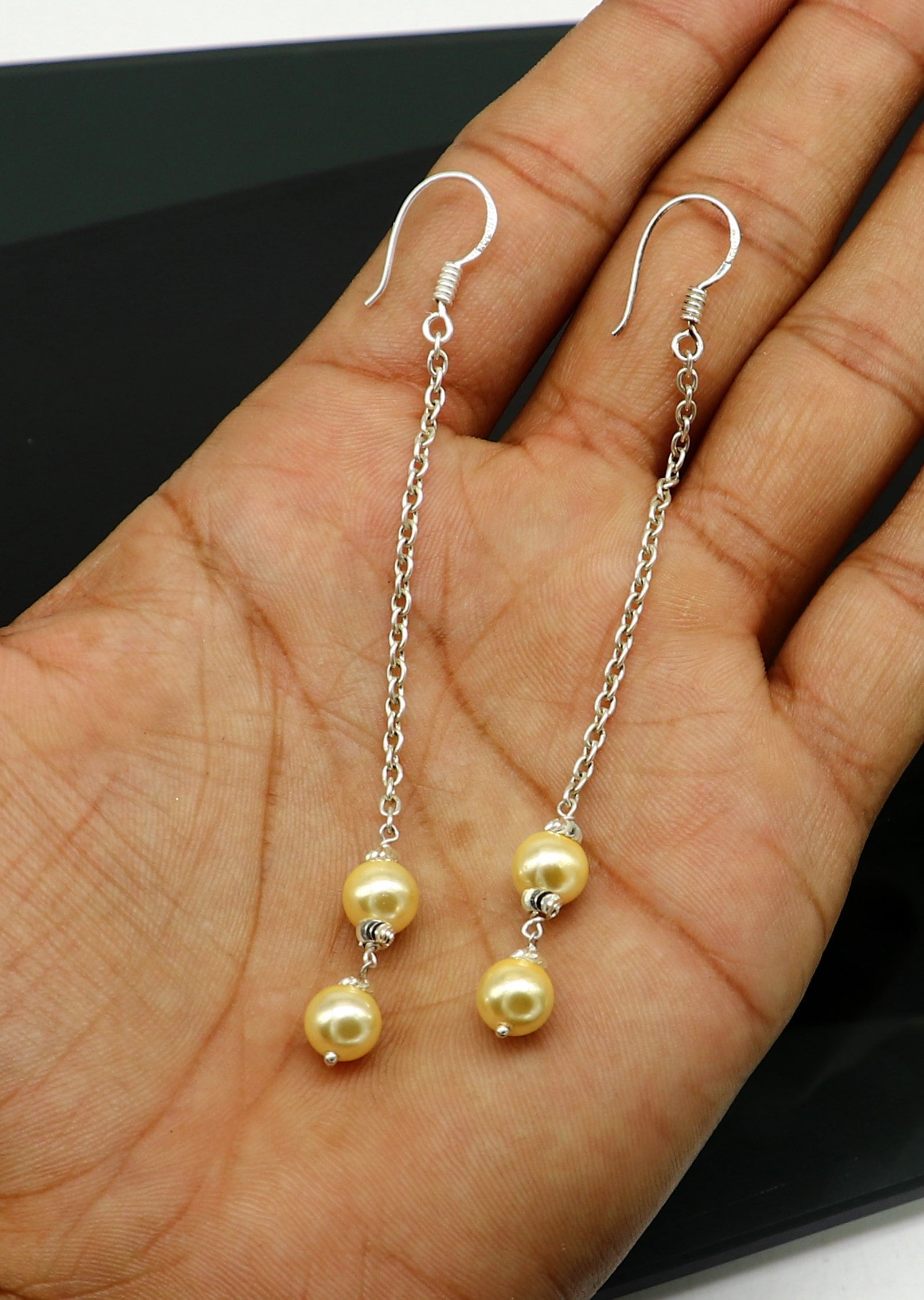 Handmade 925 sterling silver hoop earrings with dangling pearls, perfect for bridesmaids, featuring a customized hook design.