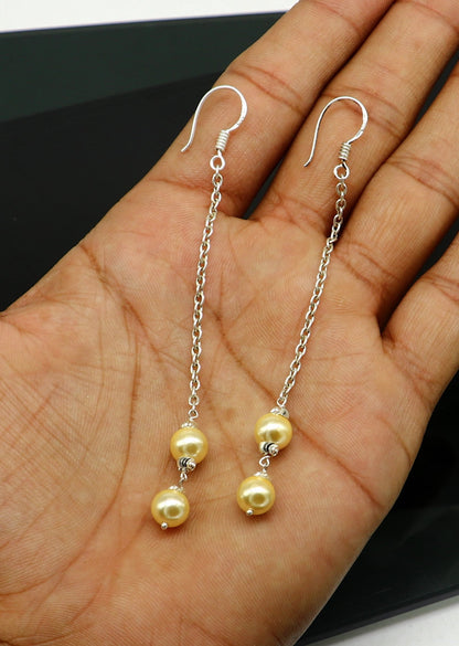 Handmade 925 sterling silver hoop earrings with dangling pearls, perfect for bridesmaids, featuring a customized hook design.