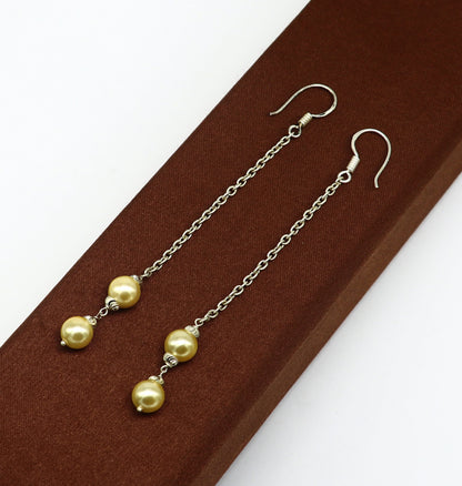 Sterling silver handmade hoop earrings with dangling pearls, perfect for bridesmaids, featuring a customized hook design.