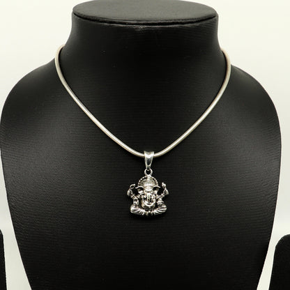 Sterling silver Ganesha pendant by Tribal Ornaments, handmade unisex jewelry with intricate tribal design and personalized style.
