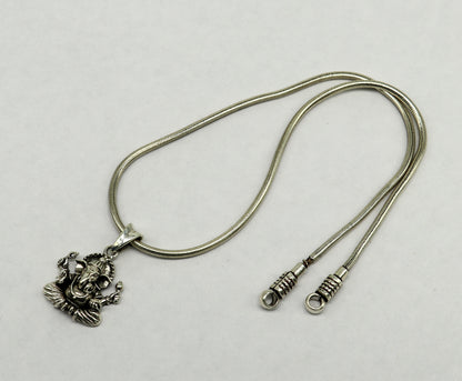 Sterling silver Ganesha pendant, handmade tribal jewelry, unisex personalized idol necklace, intricate design with detailed craftsmanship.