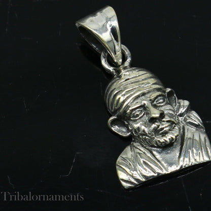 Sterling silver Sai Baba pendant by TRIBAL ORNAMENTS, unisex handmade jewelry featuring a detailed Indian deity design.