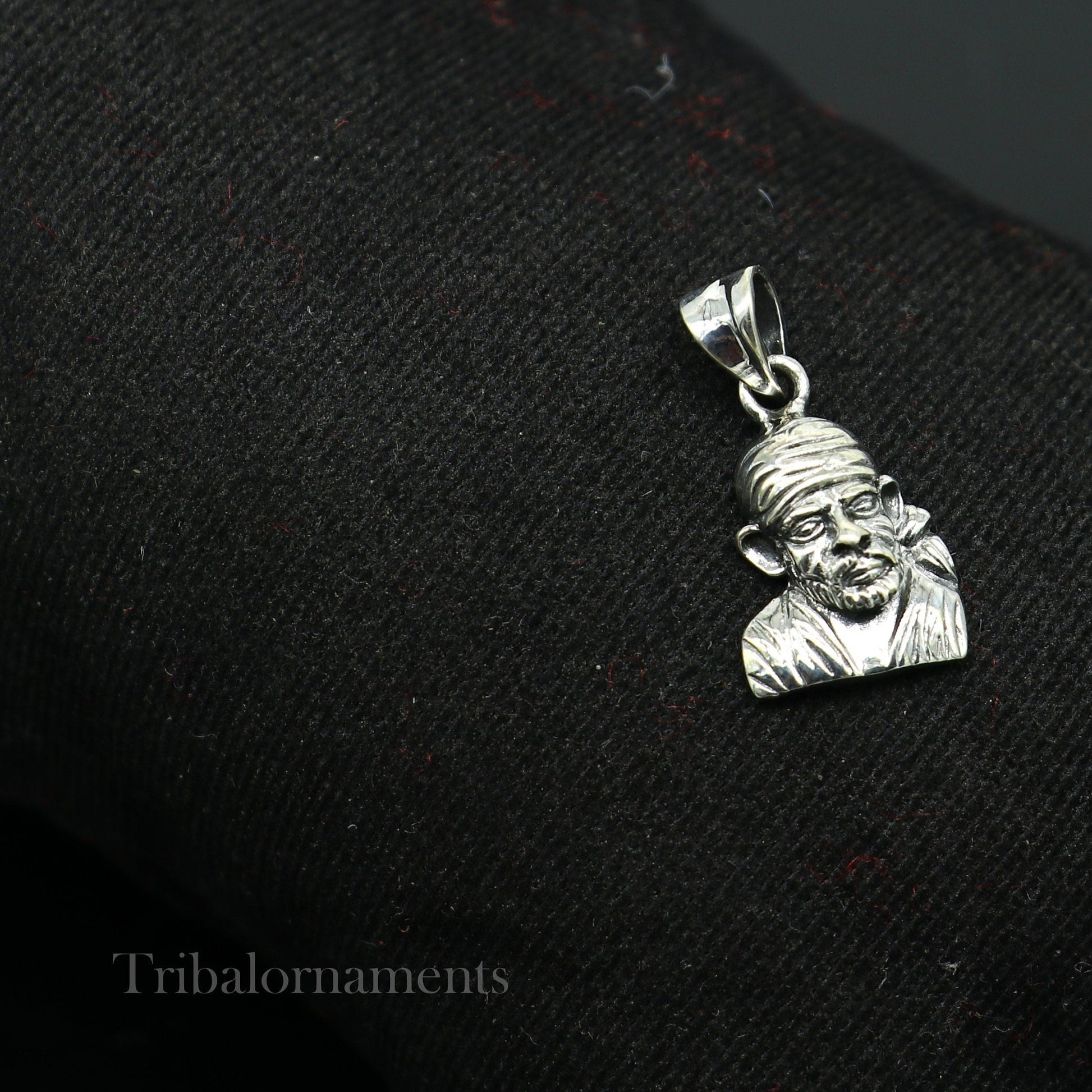 925 sterling silver Sai Baba pendant, handcrafted unisex jewelry, featuring detailed Indian deity design, personalized tribal jewelry.