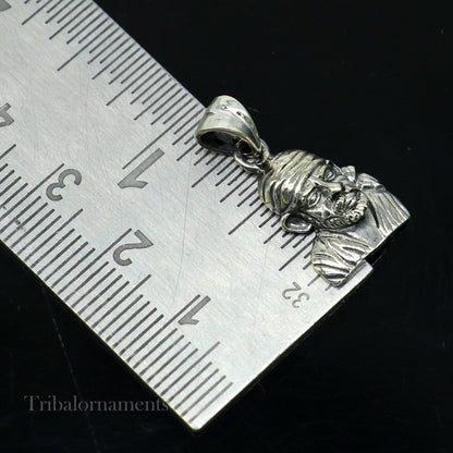 Sterling silver Sai Baba pendant by TRIBAL ORNAMENTS, handcrafted unisex jewelry featuring a divine Indian deity design.