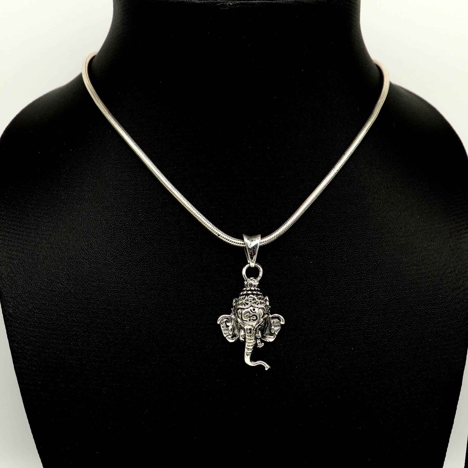 925 sterling silver Ganesha pendant featuring a detailed Hindu idol design, handmade tribal jewelry, unisex and personalized.
