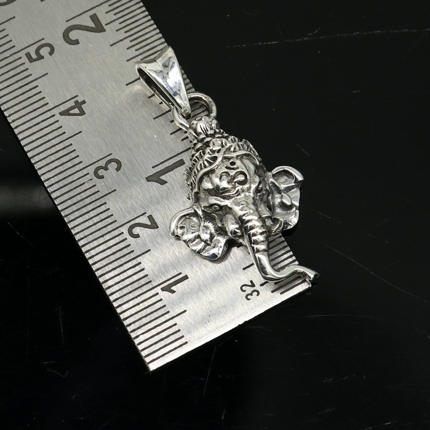 Handmade 925 sterling silver Ganesha pendant, featuring tribal design, unisex style, personalized jewelry, and intricate Indian idol craftsmanship.