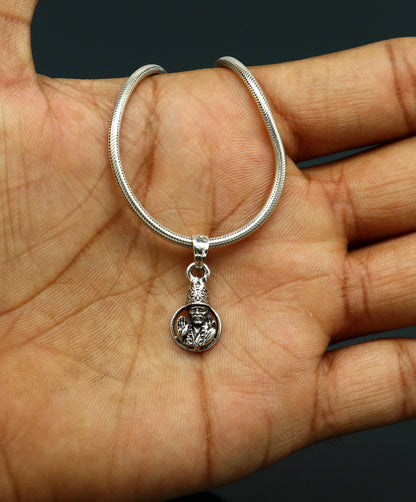 Sterling silver Sai Baba pendant, unisex handmade jewelry featuring detailed Indian idol design, personalized tribal accessory.