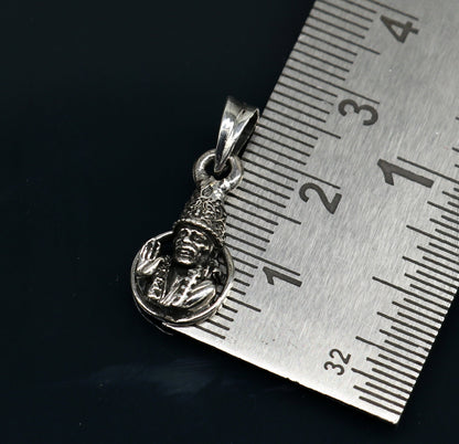 Sterling silver Sai Baba pendant with intricate Indian idol design, unisex style, handcrafted tribal jewelry by TRIBAL ORNAMENTS