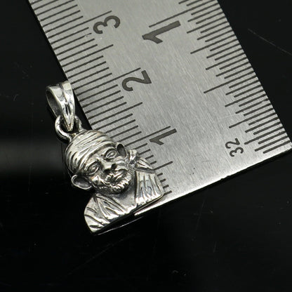 Sterling silver Sai Baba pendant by Tribal Ornaments, handmade unisex jewelry featuring detailed Indian idol design.
