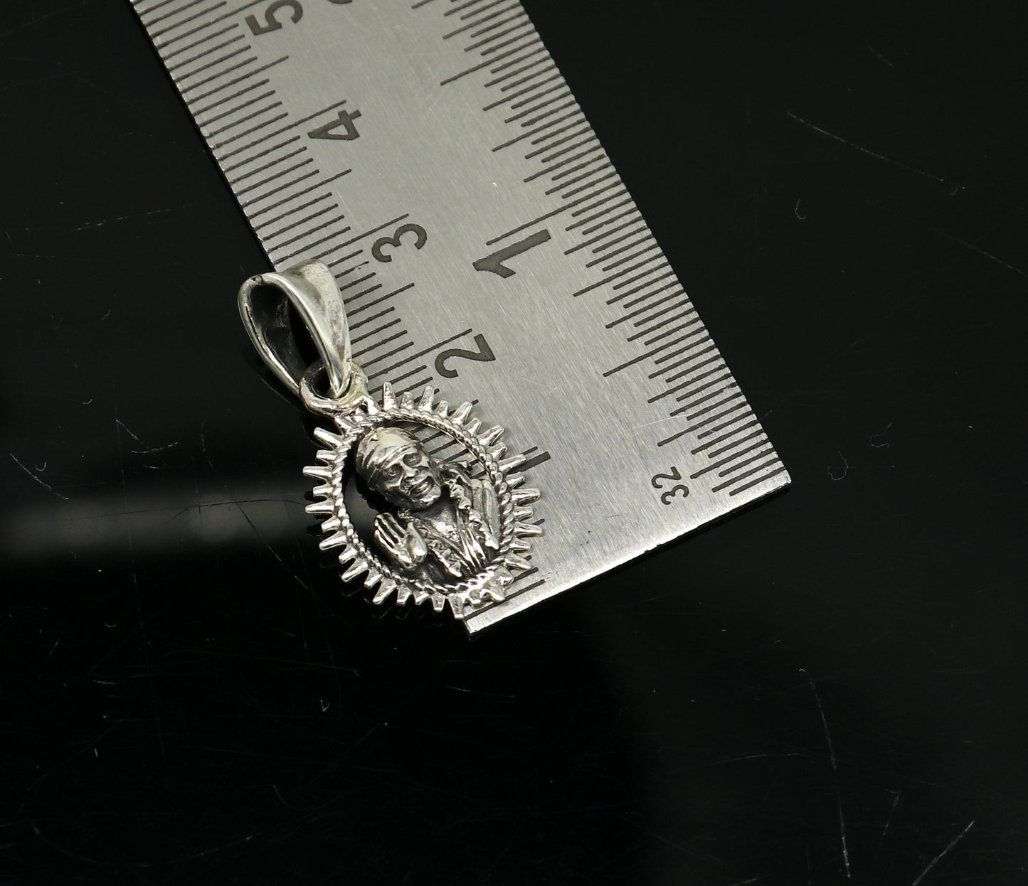 925 sterling silver Sai Baba pendant featuring intricate handmade Indian design, stylish unisex jewelry from Tribal Ornaments.