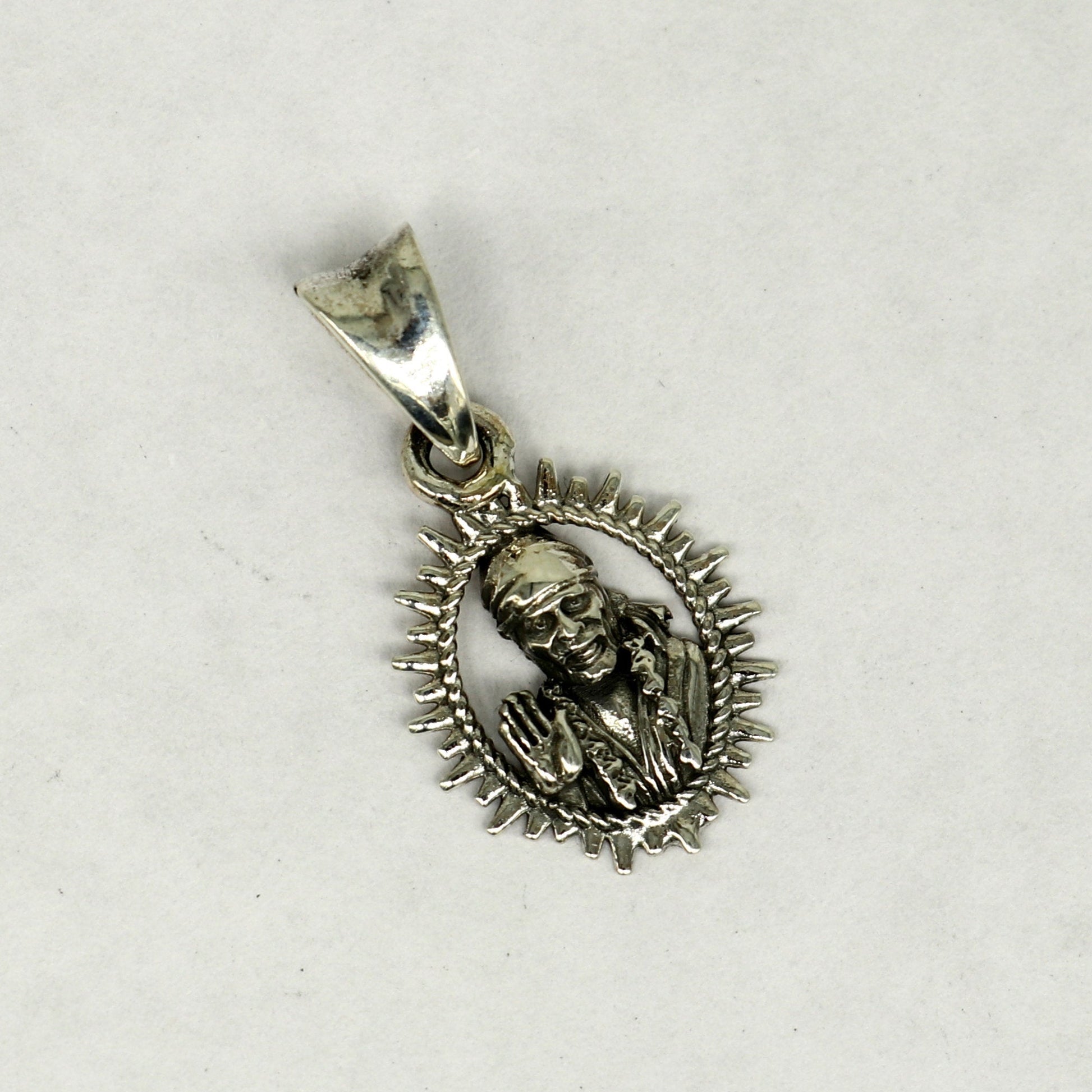 Sterling silver Sai Baba pendant by Tribal Ornaments, featuring intricate handmade Indian design, unisex personalized jewelry.