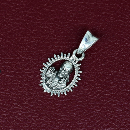 Sterling silver Sai Baba pendant by TRIBAL ORNAMENTS, handmade Indian religious jewelry, stylish unisex locket.