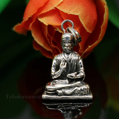 Sterling silver Sai Baba pendant by TRIBAL ORNAMENTS, unisex handmade religious jewelry in a detailed idol design.