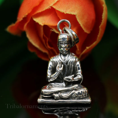 Sterling silver Sai Baba pendant by TRIBAL ORNAMENTS, handmade unisex Indian jewelry with detailed idol design and personalized style.