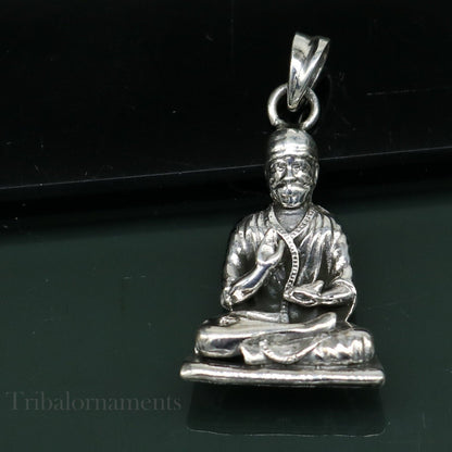 Sterling silver Sai Baba pendant by Tribal Ornaments, handmade unisex jewelry featuring an intricate Indian idol design.