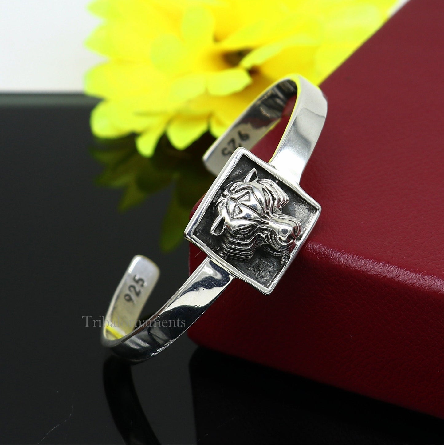 Sterling silver lion face design adjustable bangle cuff bracelet by TRIBAL ORNAMENTS, unisex ethnic jewelry with intricate craftsmanship.