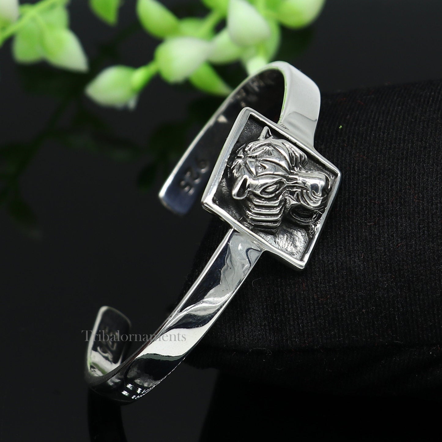 Sterling silver lion face design adjustable bangle cuff bracelet by Tribal Ornaments, unisex ethnic jewelry with detailed craftsmanship.