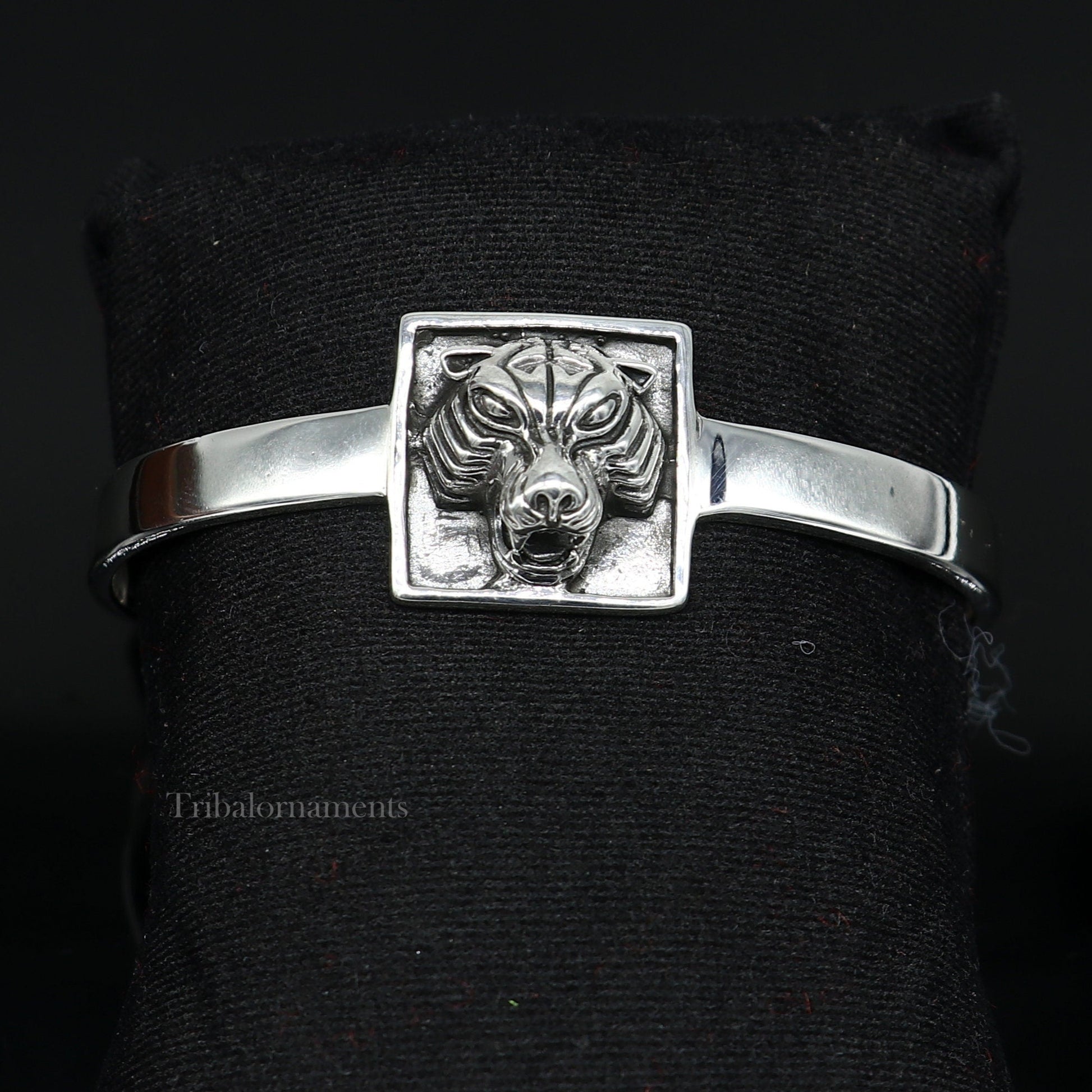 Sterling silver lion face design adjustable bangle cuff bracelet by Tribal Ornaments, unisex ethnic jewelry, handcrafted in India.
