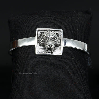 Sterling silver lion face design adjustable bangle cuff bracelet by Tribal Ornaments, unisex ethnic jewelry, handcrafted in India.