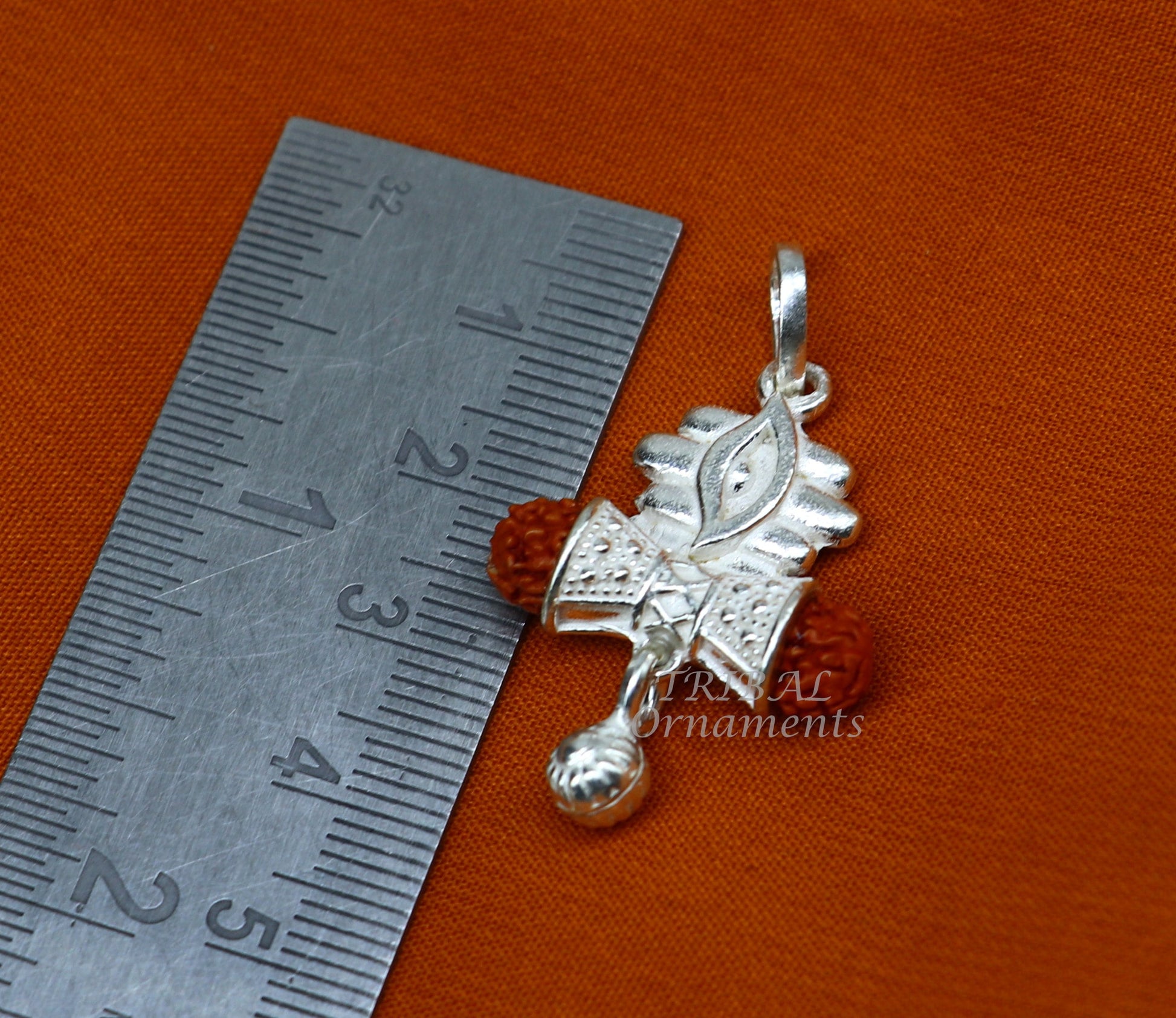 Sterling silver Lord Shiva damaru Rudraksha pendant for unisex jewelry, featuring intricate handmade design from Tribal Ornaments.