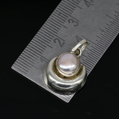 925 sterling silver moon pendant with natural pearl, handmade unisex jewelry by TRIBAL ORNAMENTS featuring a celestial design.