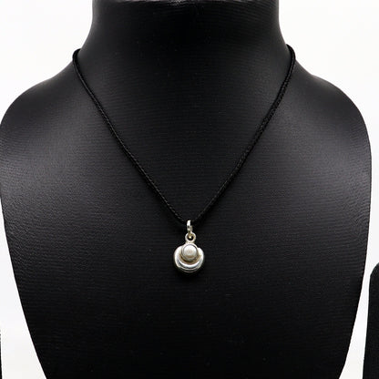 925 sterling silver moon pendant with natural pearl, unisex jewelry from TRIBAL ORNAMENTS, showcasing a handcrafted celestial design.