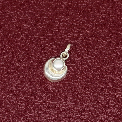 Sterling silver moon pendant with natural pearl, unisex jewelry by TRIBAL ORNAMENTS, showcasing a handcrafted celestial design.