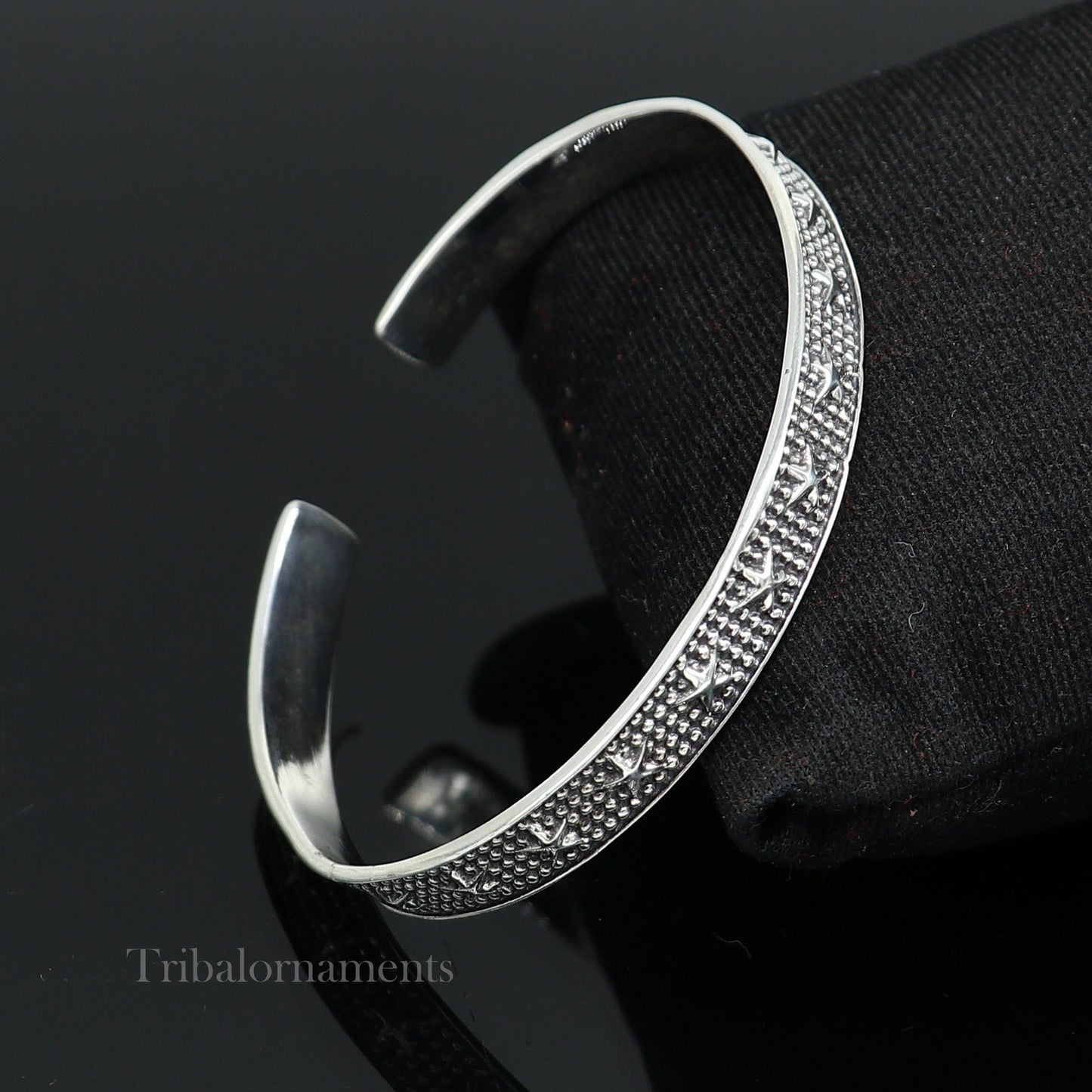 925 sterling silver open face cuff bracelet by Tribal Ornaments, adjustable handmade jewelry with tribal design and elegant craftsmanship.