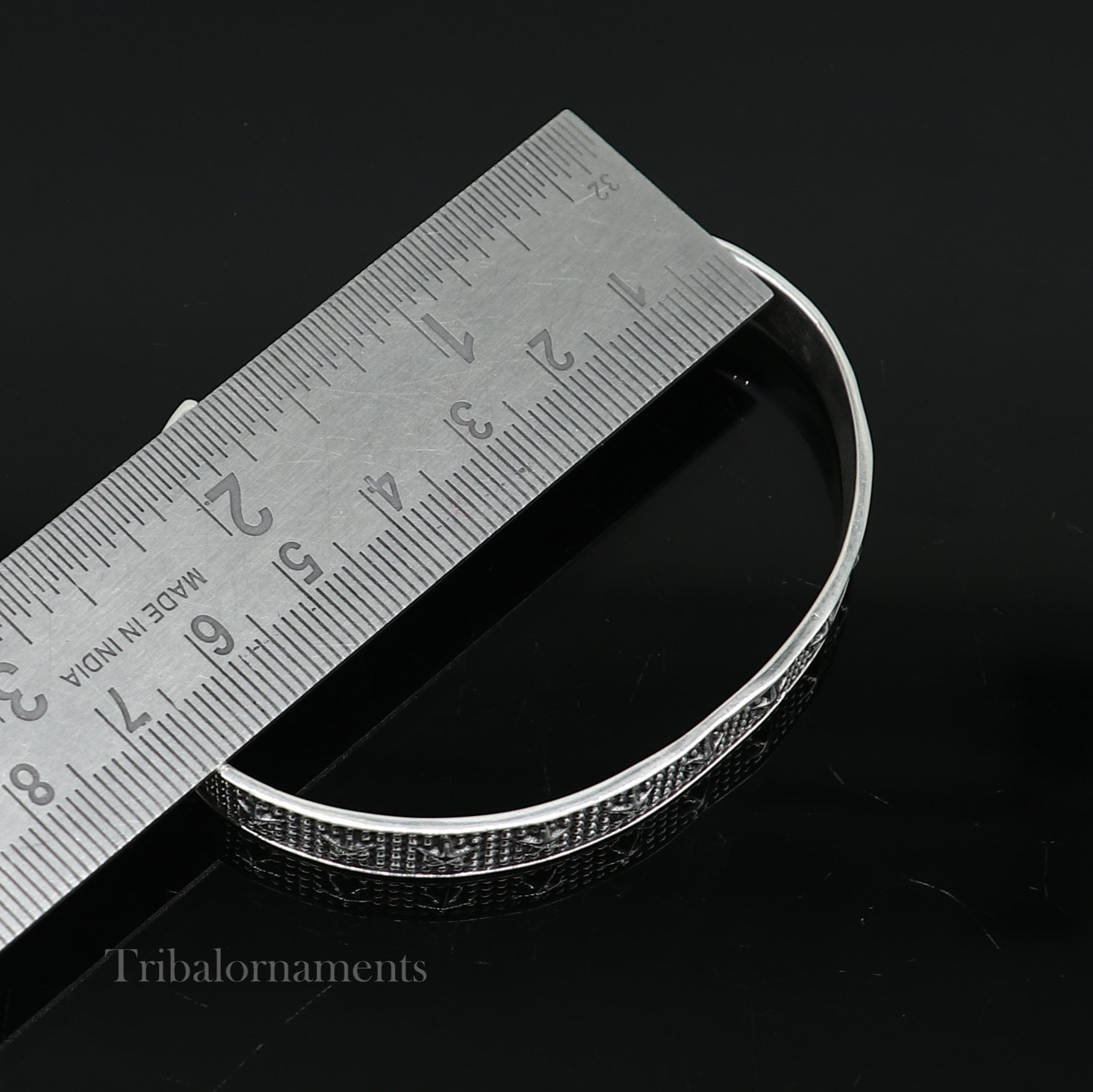 Sterling silver open face cuff bangle bracelet by TRIBAL ORNAMENTS, adjustable handmade jewelry from India.