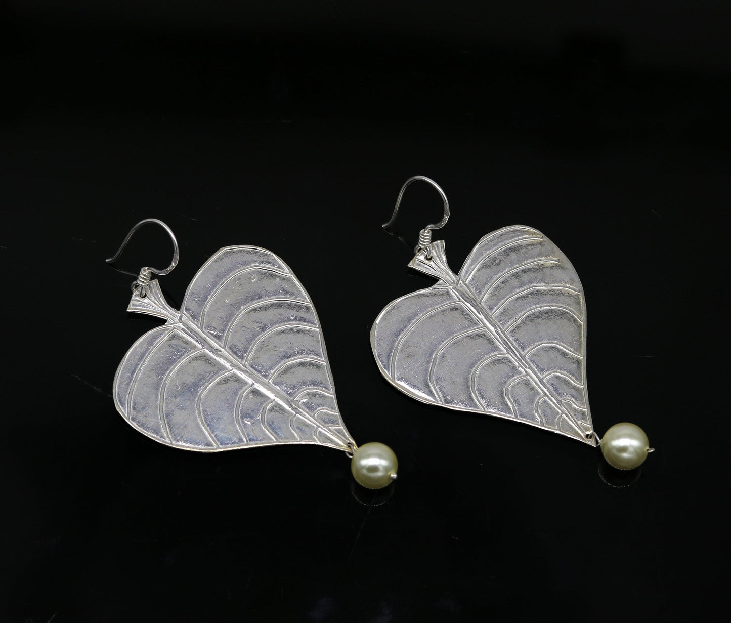 Sterling silver handmade peepal tree leaf earring with hanging pearl, customized hoop design from Tribal Ornaments summer collection.