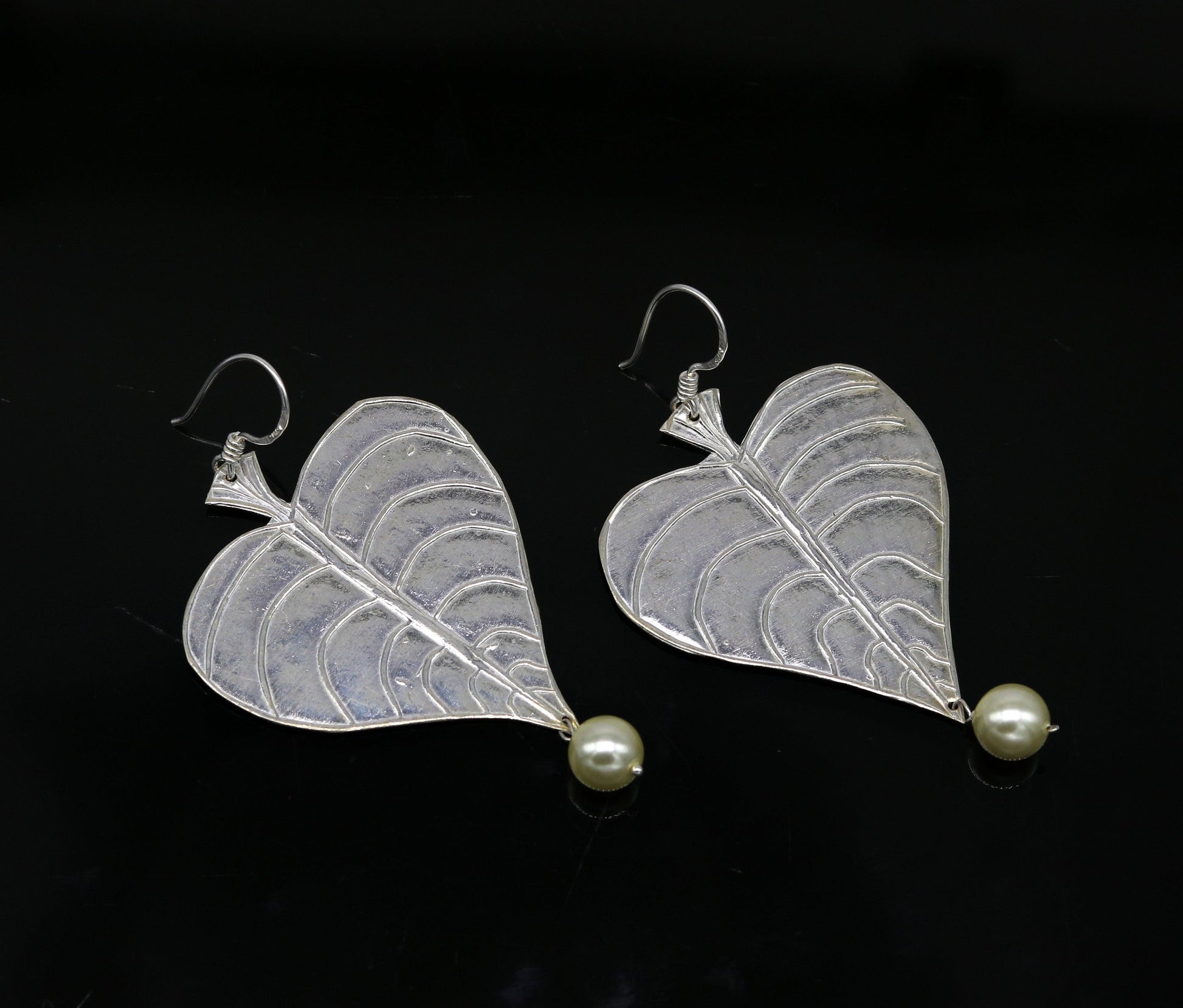 Sterling silver handmade peepal tree leaf earring with hanging pearl, customized hoop design from Tribal Ornaments summer collection.