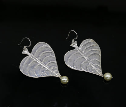 Sterling silver handmade peepal tree leaf earring with hanging pearl, customized hoop design from Tribal Ornaments summer collection.