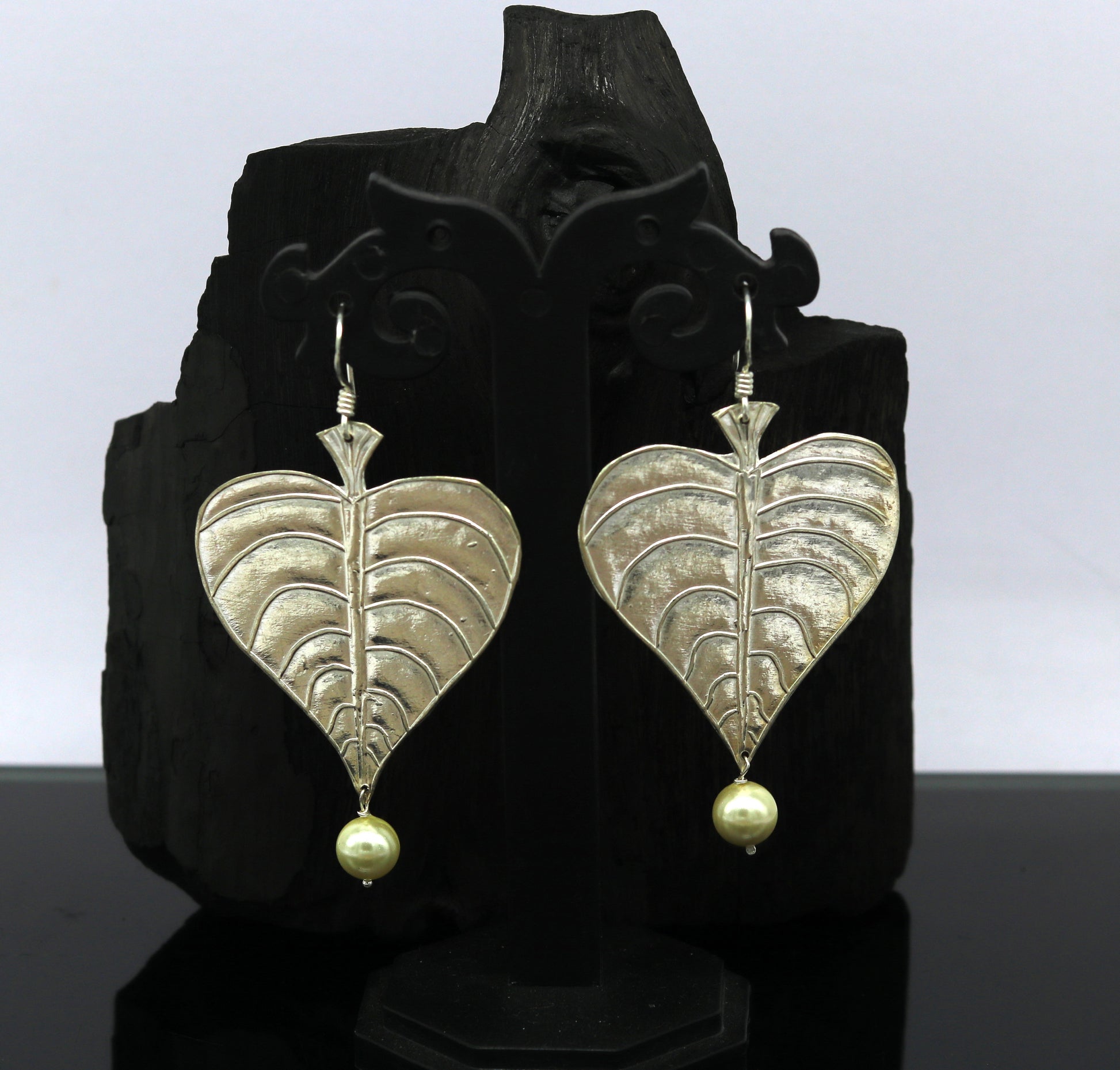 Sterling silver handmade peepal tree leaf earring with hanging pearl, stylish custom hoop earring from Tribal Ornaments summer collection.