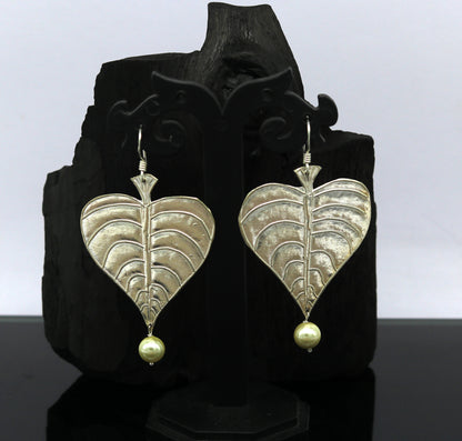 Sterling silver handmade peepal tree leaf earring with hanging pearl, stylish custom hoop earring from Tribal Ornaments summer collection.