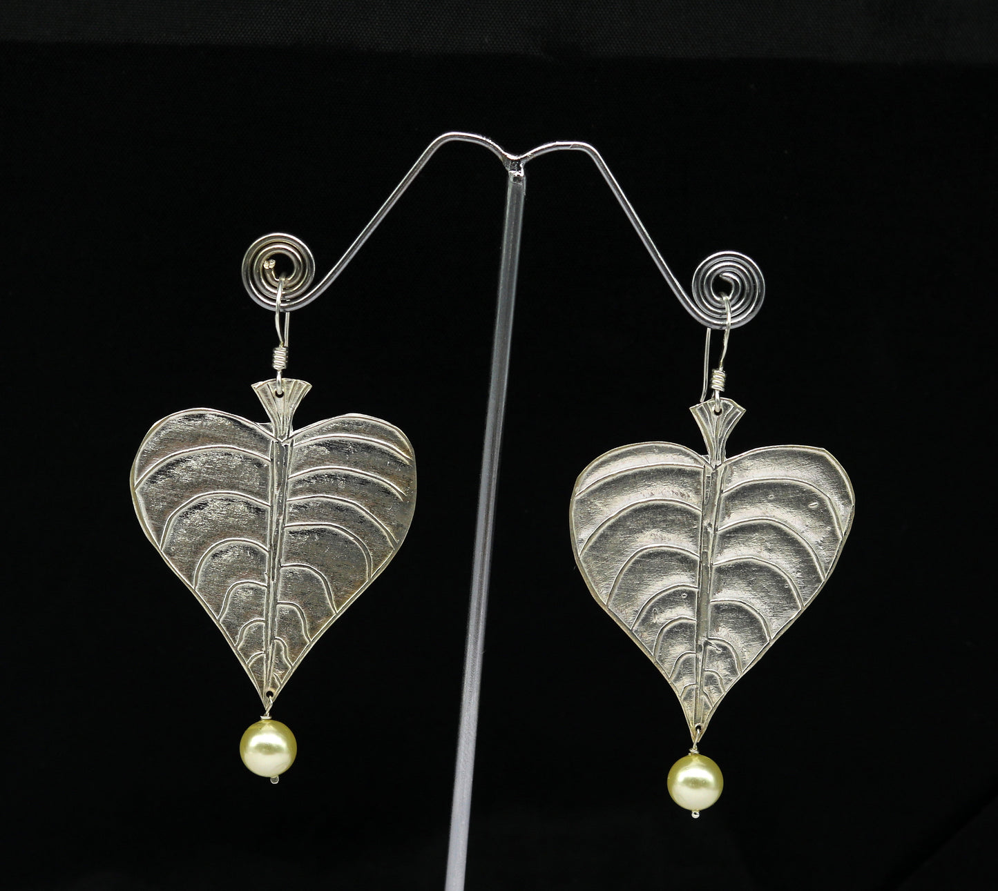Sterling silver handmade peepal tree leaf earring with hanging pearl, stylish hoop design from Tribal Ornaments summer collection.