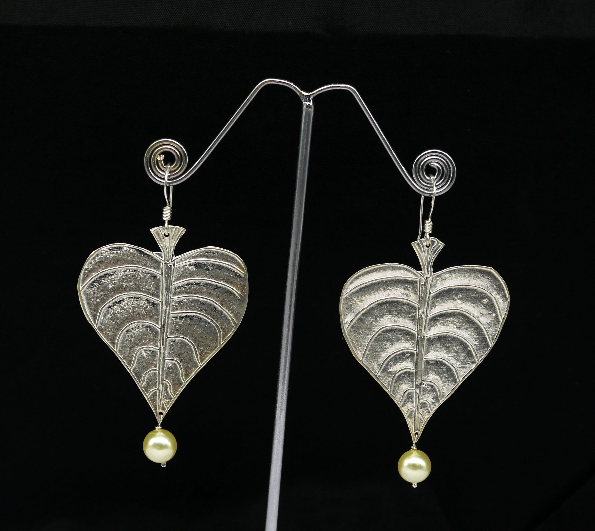 Sterling silver handmade peepal tree leaf earring with hanging pearl, stylish hoop design from Tribal Ornaments summer collection.