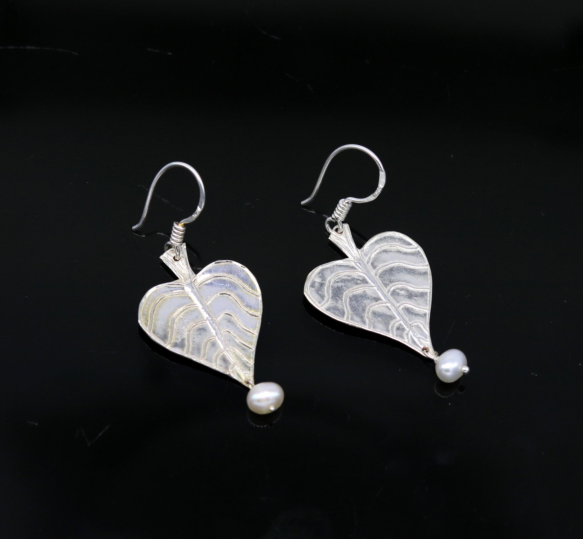 Sterling silver handmade peepal tree leaf earring with hanging pearl, customized hoops in summer collection by TRIBAL ORNAMENTS.