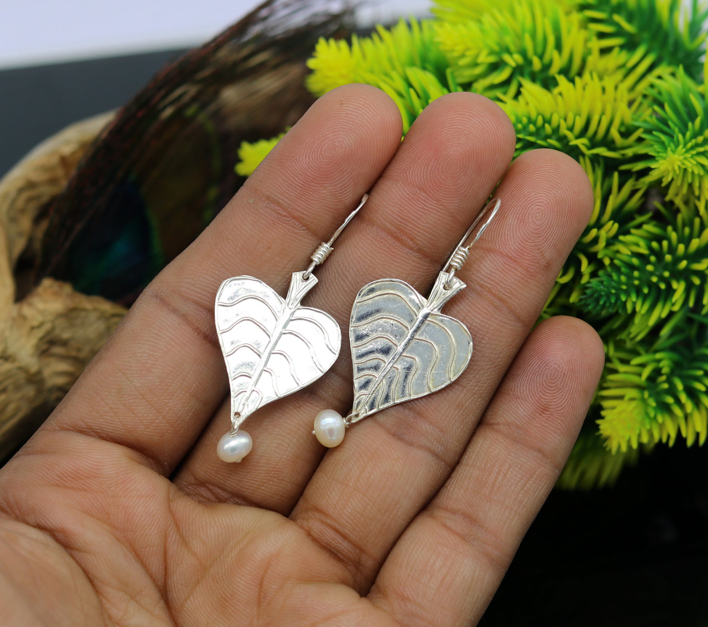 Sterling silver handmade peepal tree leaf earring with hanging pearl from Tribal Ornaments, summer collection jewelry.