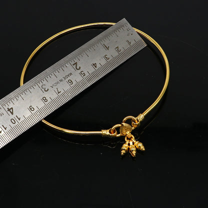 Sterling silver handmade foot bracelet with shiny gold polish, featuring a sleek design for ankle and belly dance jewelry.