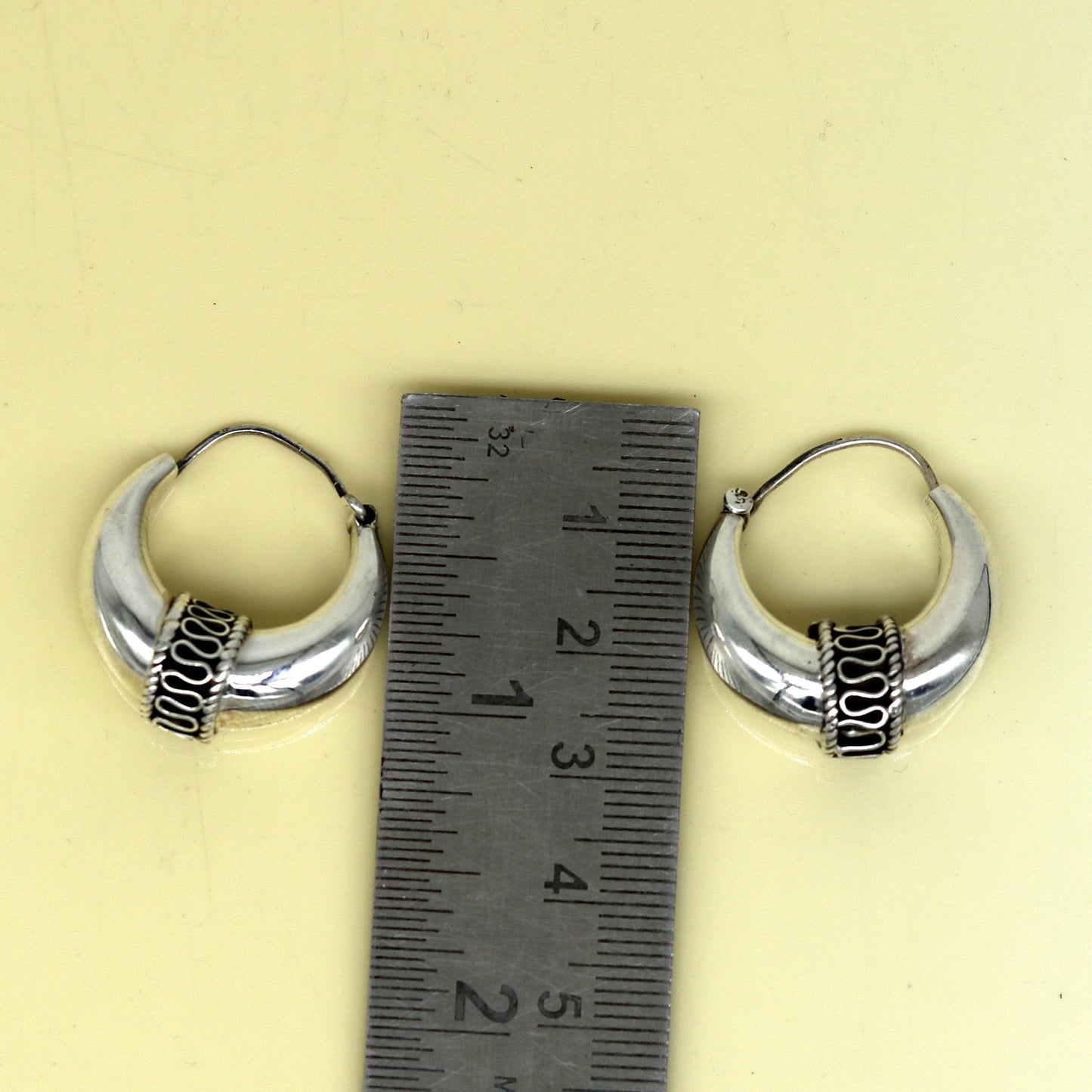 Sterling silver handmade hoop earrings by Tribal Ornaments, stylish Bali-inspired stud earrings with personalized design.