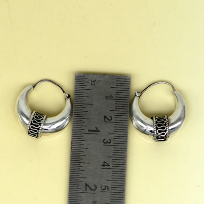 Sterling silver handmade hoop earrings by Tribal Ornaments, stylish Bali-inspired stud earrings with personalized design.