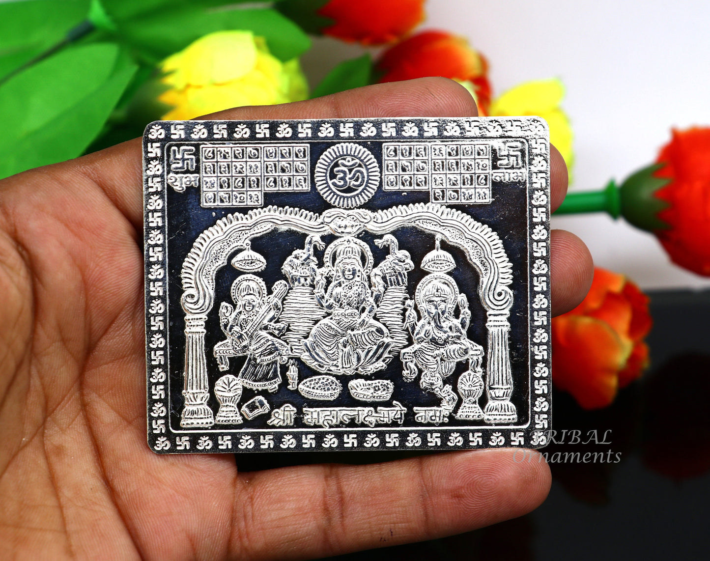 925 sterling silver Shree Mahalakshmi frame with Ganesha and Saraswati, featuring intricate handcrafted divine motifs for wealth and prosperity.