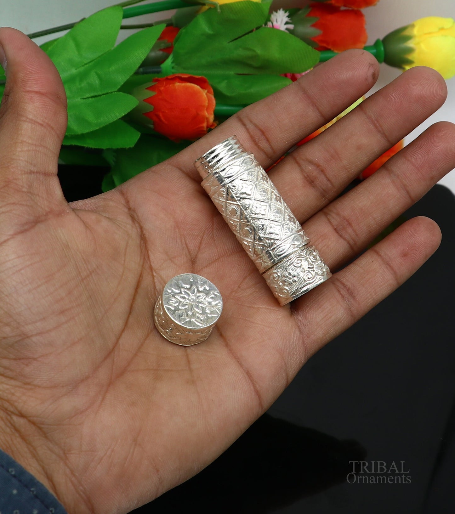 Sterling silver handmade small pill and tobacco storage box by TRIBAL ORNAMENTS, featuring intricate silver utensils and personal design.