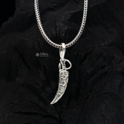 Sterling silver handmade small sword pendant by TRIBAL ORNAMENTS, unisex dagger-style jewelry with detailed design.