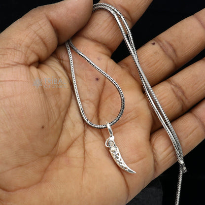 Sterling silver handmade small sword pendant by TRIBAL ORNAMENTS, unisex dagger-style jewelry with intricate design.