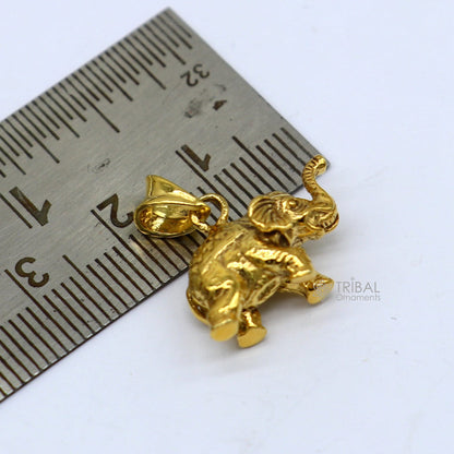 925 sterling silver elephant pendant by TRIBAL ORNAMENTS, gold-polished, handmade jewelry with intricate design and lucky charm appeal.