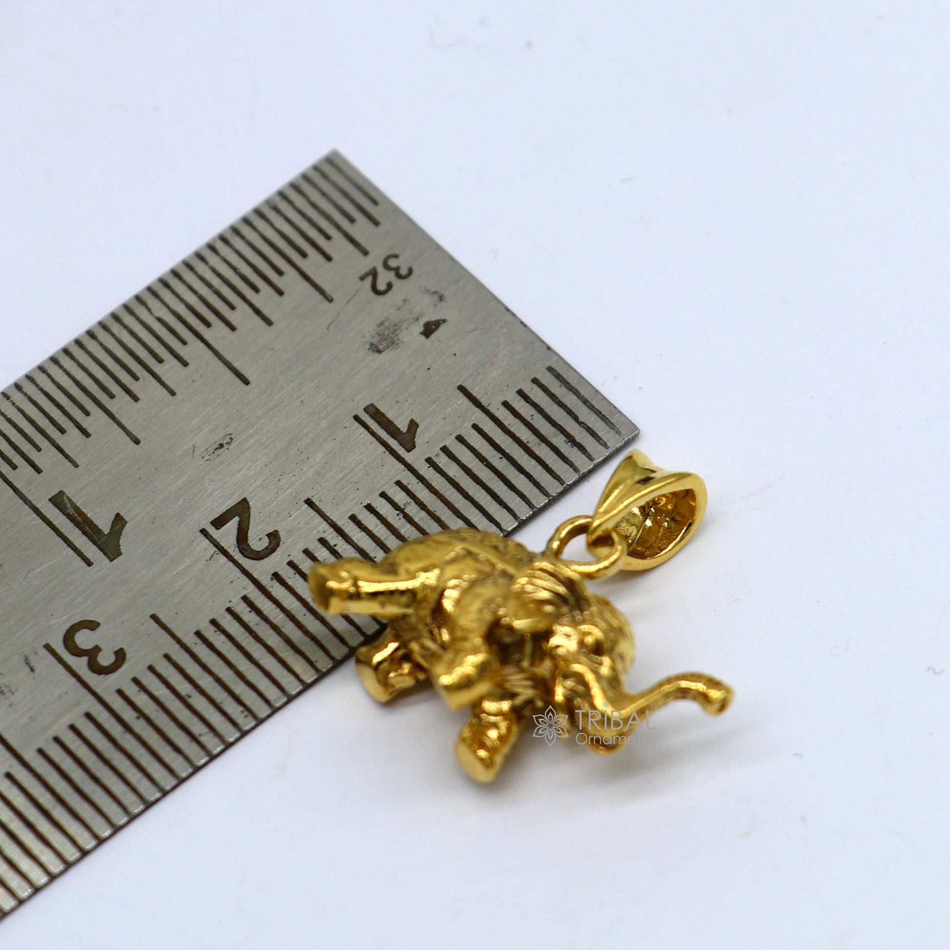 925 sterling silver elephant pendant with a gold polished finish, handmade tribal jewelry, featuring a small, detailed elephant design.